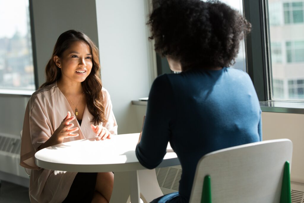 two business women talking